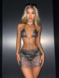 Sparkly rhinestone two-piece halter top and mini skirt set with chain waist detail