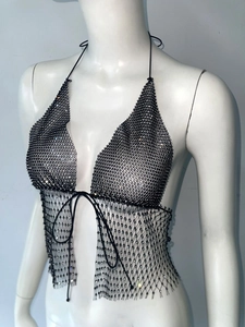 Detailed view of black rhinestone mesh halter top with crystal chain texture