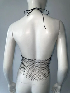 Detail of black mesh body chain with sparkling sequins and halter tie design