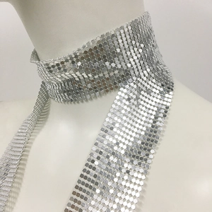 Close-up detail of silver sequin metal mesh choker with reflective metallic finish