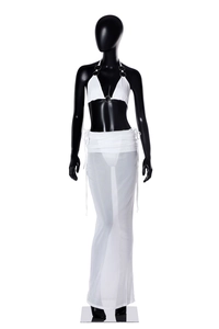 Detail of white bikini top with metal ring connector and mesh drawstring maxi skirt