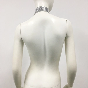 Detailed back view of silver mesh choker necklace on model with metallic chain texture