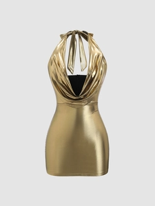 Detailed view of the metallic gold cowl neck and halter straps on a sexy bodycon dress