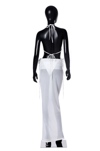 Rear view of three-piece white beach set with halter top and sheer mesh maxi skirt