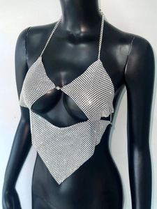 Macro shot of silver sequin metal mesh and rhinestone details on halter top