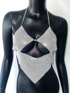 Detail of silver sequin halter top with metal chains and shimmering fish scale texture
