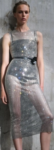 Detailed view of silver mesh dress with rhinestones and black floral waist belt