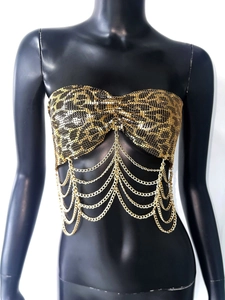 Detail of leopard print sequin bandeau top with layered gold chain fringe tassels