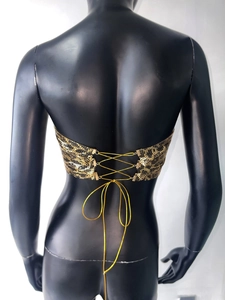 Detailed back view of leopard print metal sequin halter top with crisscross gold ties