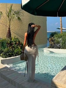 Sexy three-piece bikini set with sheer drawstring cover-up skirt for beach vacation