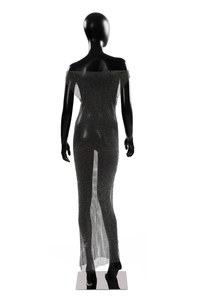 Macro view of sparkling silver rhinestones on sheer black mesh of this slim-fit dress