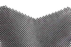 Detailed close-up of black mesh fabric with sparkling rhinestones for evening gowns
