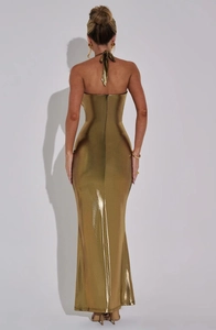 Detail of a sleek back view showing hidden zipper on a gold sequin halter maxi dress