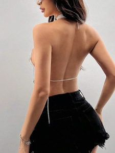 Detail of silver rhinestone halter top showing backless chain link design and shimmer