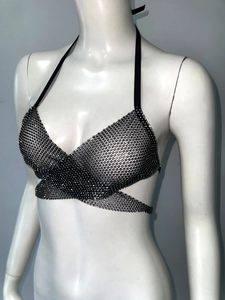 Detail of black mesh body chain with sparkling rhinestones and halter neck tie