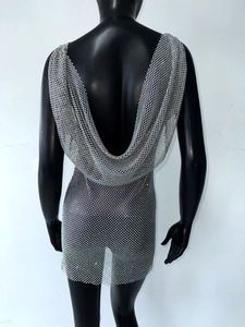 Detail of silver rhinestone mesh mini dress with open back and sparkling metallic mesh