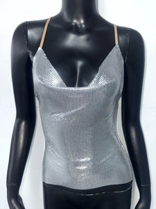 Detail of silver metallic sequin mesh halter top with V-neckline and draped metal texture