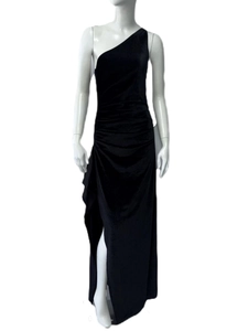 Detail of elegant black velvet one-shoulder evening gown with a high side leg slit