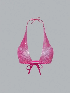 Detail of hot pink halter top featuring shimmering rhinestones and secure tie-up straps