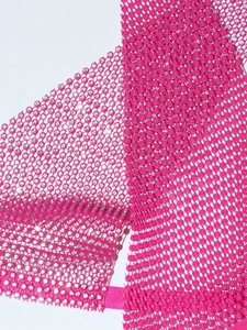 Detail of pink mesh fabric with sparkling rhinestones and matching elastic band