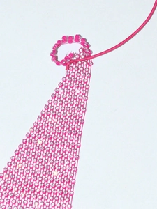 Detail of pink mesh halter top featuring sparkling rhinestones in a grid pattern