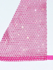 Close-up of pink mesh fabric with shimmering rhinestones for party wear detail