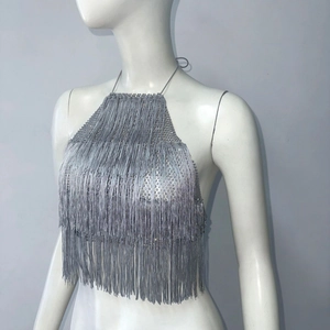 Close-up of silver multilayer fringe halter top with shimmering rhinestone neck detailing