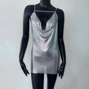 Detailed view of silver metal mesh texture and chunky chain straps on V-neck party dress