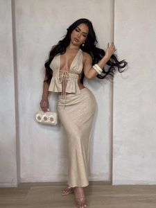 Chic beige two-piece set featuring halter neck top and slim fit maxi skirt for women