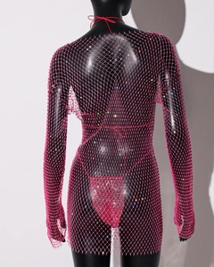 Detail of hot pink rhinestone fishnet dress with sparkling crystal mesh texture