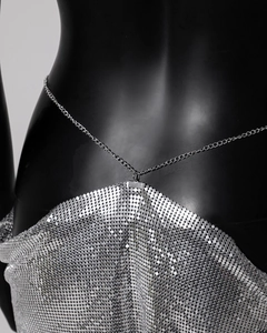 Detail view of silver metal sequins mesh texture with adjustable lobster clasp chain