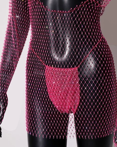 Detail of hot pink rhinestone mesh dress with hand-beaded diamond pattern texture
