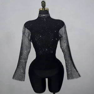 Close-up of black mesh top with sparkling rhinestones and elegant bell sleeves