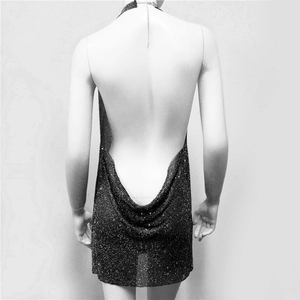 Detail of the backless halter design with shimmering black metallic mesh fabric