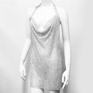 Detail of silver sequin cowl neck party dress with metallic mesh fabric texture