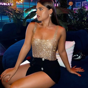 Close-up detail of golden sequin camisole top with sparkling rhinestone texture finish