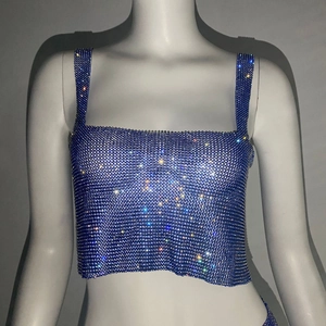 Detail view of the shimmering blue sequin and rhinestone mesh on a cropped tank top