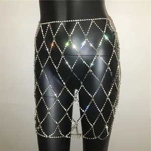 Detail view of silver rhinestone mesh body chain skirt with hollow diamond grid pattern