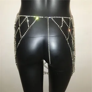 Detail of layered rhinestone body chain skirt with crisscross diamond patterns