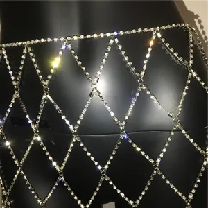 Macro detail of sparkling diamond mesh skirt with silver rhinestone grid structure