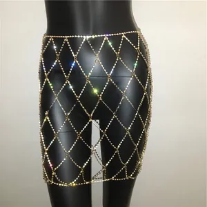 Detail of rhinestone mesh body chain with hollow diamond grid pattern on black mannequin