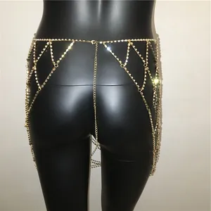 Detailed close-up of golden rhinestone body chain with geometric hollow mesh design