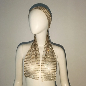 Close-up of golden mesh headscarf with sparkling rhinestones and metallic finish