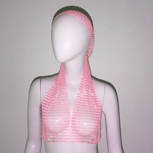 Detailed close-up of pink sparkly mesh headscarf with shimmering sequins on pink netting