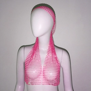 Detail of bright pink rhinestone mesh headscarf vest for party and festival wear