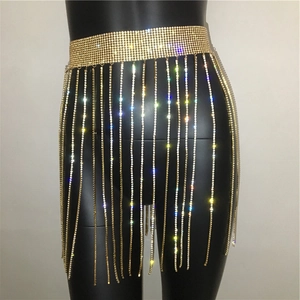 Detailed view of golden rhinestone fringe waist chain with shimmering tassel accents