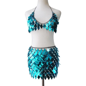 Detailed view of turquoise sequin two-piece set featuring diamond-shaped metal scales