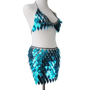 Detail of bright blue diamond sequin two-piece body chain set with black metal links