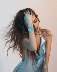 Detail of silver sequin halter dress with sparkling diamond bracelet and necklace set