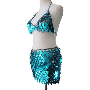 Detail of bright blue metallic sequin set with halter top and mini skirt for parties